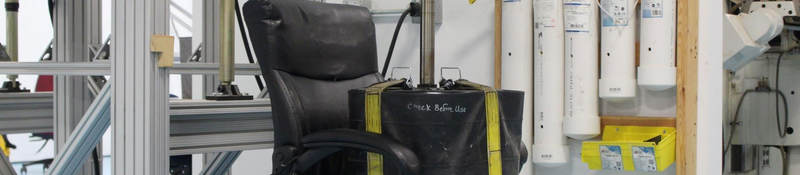 A weight sits on an office chair as part of testing